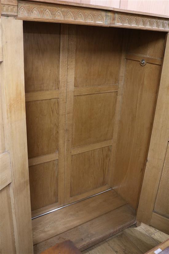 A five piece carved oak bedroom suite